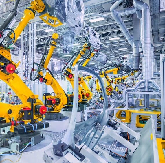 52036540 - robotic arms in a car plant 52036540 - robotic arms in a car plant